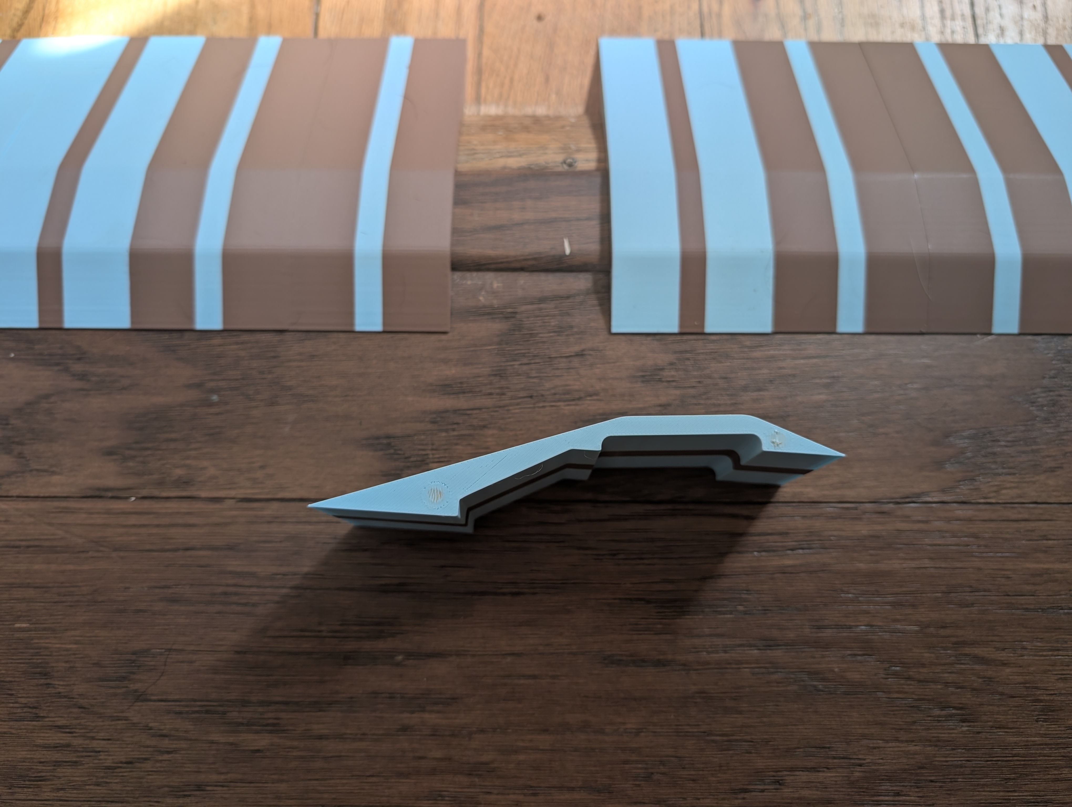 Side view of a piece, with magnet holes